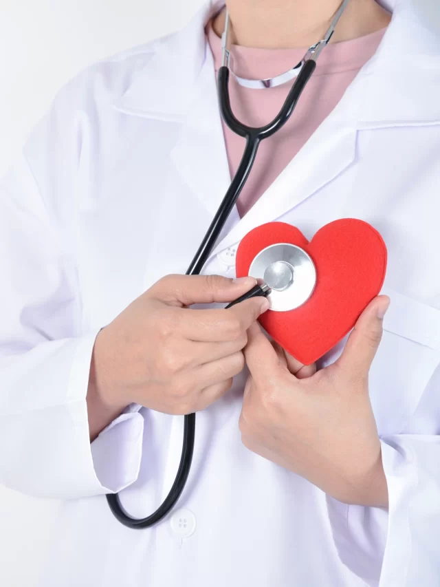 young-female-doctor-with-stethoscope-holding-red-heart-her-hand-white-background